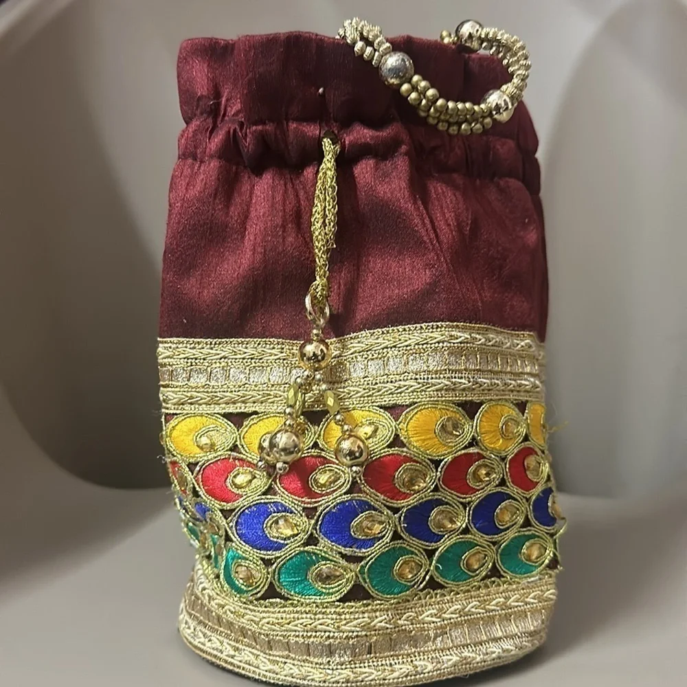 Beaded peacock colored jewelry bag